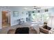 Living room with access to a bathroom and sliding doors to a balcony at 8409 Placida Rd # 308, Placida, FL 33946