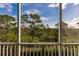 Peaceful view of lush green landscape from the balcony at 8409 Placida Rd # 308, Placida, FL 33946