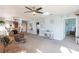 Spacious living room with light gray carpet and ceiling fan at 8409 Placida Rd # 308, Placida, FL 33946