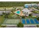 Aerial view showing resort-style amenities including pool and courts at 8409 Placida Rd # 308, Placida, FL 33946