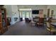 Bright and airy community room with comfortable seating and a TV at 13524 Abercrombie Dr, Englewood, FL 34223