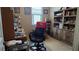 Home office with built-in shelving and a comfortable chair at 13524 Abercrombie Dr, Englewood, FL 34223