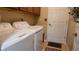 Laundry room with washer, dryer, and utility sink at 13524 Abercrombie Dr, Englewood, FL 34223