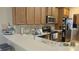 Well-equipped kitchen with ample cabinetry and a breakfast bar at 13524 Abercrombie Dr, Englewood, FL 34223