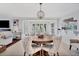 This dining area features a round table, stylish chairs, and plenty of natural light at 11000 Placida Rd # 2502, Placida, FL 33946