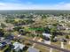 Aerial shot showcases 6517 Kenwood Dr nestled in a serene neighborhood with lush surroundings and community charm at 6517 Kenwood Dr, North Port, FL 34287