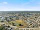 Aerial view showcases a community with lovely waterways, perfect for peaceful living and outdoor enjoyment at 6517 Kenwood Dr, North Port, FL 34287