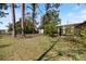 Expansive backyard with mature trees at 6517 Kenwood Dr, North Port, FL 34287