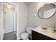 Modern bathroom with a large sink, toilet, and access to the shower-tub combo at 6517 Kenwood Dr, North Port, FL 34287