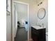 Modern bathroom featuring a sink, toilet, and view into a bedroom at 6517 Kenwood Dr, North Port, FL 34287