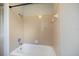 Clean bathroom features a pink tiled shower-tub combo at 6517 Kenwood Dr, North Port, FL 34287