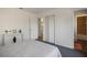 Bedroom showing carpet, closet, ensuite bathroom, and hallway views at 6517 Kenwood Dr, North Port, FL 34287