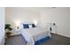 Bedroom with carpet, white furniture, large window, and tasteful decor at 6517 Kenwood Dr, North Port, FL 34287