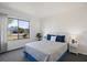 Bedroom features a large window, providing lots of natural light, carpet, and tasteful decor at 6517 Kenwood Dr, North Port, FL 34287