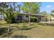 Quaint single-story house with well-kept lawn and attractive landscaping at 6517 Kenwood Dr, North Port, FL 34287