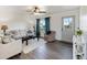 Comfortable living room with neutral furniture, ceiling fan, and lots of natural light at 6517 Kenwood Dr, North Port, FL 34287