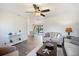 Open-concept living room with dining area and wood flooring at 6517 Kenwood Dr, North Port, FL 34287
