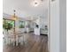 Open living area with dining table, kitchen, and living room, creating an inviting atmosphere at 6517 Kenwood Dr, North Port, FL 34287