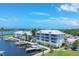 Aerial view of waterfront community with boat slips and lush landscaping at 7070 Placida Rd # 1221, Placida, FL 33946