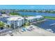 Aerial view of waterfront community with boat slips and lush landscaping at 7070 Placida Rd # 1221, Placida, FL 33946