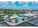 Aerial view of community pool, clubhouse, and marina at 7070 Placida Rd # 1221, Placida, FL 33946