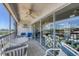 Relaxing balcony overlooking marina, with seating for enjoying the view at 7070 Placida Rd # 1221, Placida, FL 33946