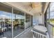 Spacious balcony with marina views and sliding glass doors at 7070 Placida Rd # 1221, Placida, FL 33946