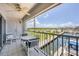 Private balcony with water views and outdoor seating area at 7070 Placida Rd # 1221, Placida, FL 33946