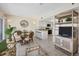 Dining area with glass table, wicker chairs, and kitchen access at 7070 Placida Rd # 1221, Placida, FL 33946