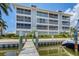 Building exterior with walkway to the dock and water access at 7070 Placida Rd # 1221, Placida, FL 33946