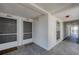 Condo hallway with two apartment doors and a window at 7070 Placida Rd # 1221, Placida, FL 33946