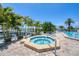 Relaxing hot tub surrounded by lush tropical landscaping at 7070 Placida Rd # 1221, Placida, FL 33946