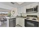 Updated kitchen with stainless steel appliances and granite countertops at 7070 Placida Rd # 1221, Placida, FL 33946