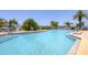 Inviting community pool with plenty of lounge chairs at 7070 Placida Rd # 1221, Placida, FL 33946