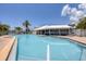 Resort-style pool with adjacent patio and shaded seating at 7070 Placida Rd # 1221, Placida, FL 33946