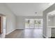 Spacious living area with light gray walls and sliding glass doors at 189 Bunker Rd, Rotonda West, FL 33947