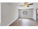 Spacious bedroom featuring wood-look floors and a ceiling fan at 189 Bunker Rd, Rotonda West, FL 33947