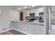 Updated kitchen, granite countertops, stainless steel appliances, and breakfast bar at 189 Bunker Rd, Rotonda West, FL 33947