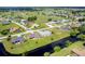 Aerial view of community with golf course and canal at 189 Bunker Rd, Rotonda West, FL 33947