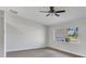 Spacious living room with hardwood floors and large window at 189 Bunker Rd, Rotonda West, FL 33947