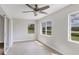Sunroom featuring tile floors, a ceiling fan, and multiple windows at 189 Bunker Rd, Rotonda West, FL 33947