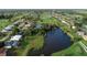 Community overview, showcasing homes, waterways, and a golf course at 189 Bunker Rd, Rotonda West, FL 33947