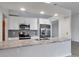 Modern kitchen with granite countertops and stainless steel appliances at 189 Bunker Rd, Rotonda West, FL 33947