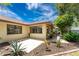 Back exterior view of the house with a patio and garden at 1867 Neptune Dr, Englewood, FL 34223