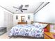 Bedroom with floral bedding and wood furniture at 1867 Neptune Dr, Englewood, FL 34223