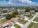 Bird's-eye view of a house with spacious yard in a residential area at 1867 Neptune Dr, Englewood, FL 34223
