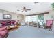 Spacious living room with ample natural light and comfortable seating at 1867 Neptune Dr, Englewood, FL 34223