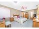 Spacious bedroom with wooden furniture, ceiling fan and carpet at 1867 Neptune Dr, Englewood, FL 34223