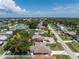 Aerial view showcasing a single-Gathering home with a large backyard at 1867 Neptune Dr, Englewood, FL 34223