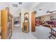 Bright and spacious entryway with built-in shelving and views to the living room at 1867 Neptune Dr, Englewood, FL 34223